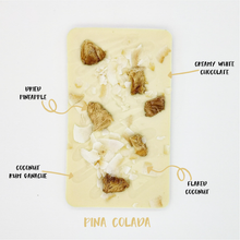 Load image into Gallery viewer, The Pina Colada One - The Home Of Fully Loaded boozy Chocolate. Large Slabbs of boozy chocolate with a variety of alcoholic ganaches; gin, rum, whisky, amaretto, baileys and toppings. Available as monthly subscriptions.
